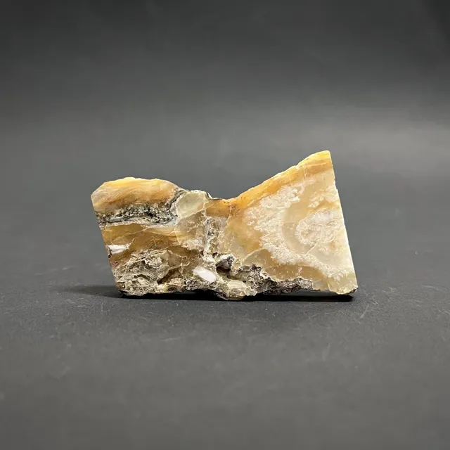 Hokkaidoite slice 1B01 in daylight (9/12) — 6.1 × 3.4 × 0.6 cm, Hokkaido, Japan · Kitsune Mineral