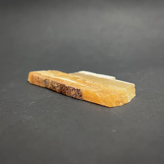 Hokkaidoite slice 1B02 in daylight (9/11) — 8.5 × 3.3 × 0.6 cm, Hokkaido, Japan · Kitsune Mineral