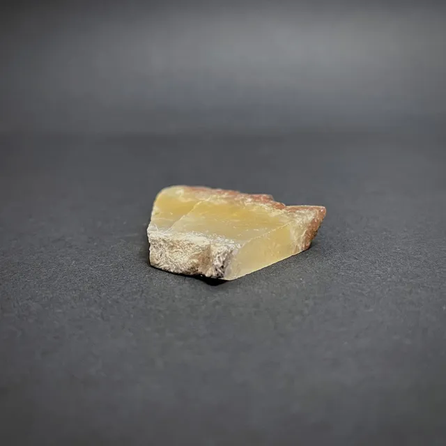 Hokkaidoite slice 1C02 in daylight (8/10) — 4.4 × 3.4 × 0.7 cm, Hokkaido, Japan · Kitsune Mineral