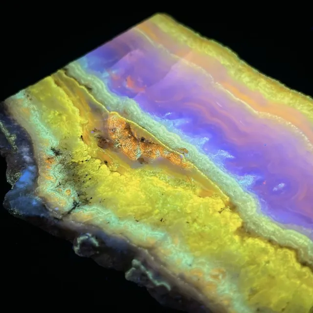 Hokkaidoite slice 2A06 under UV light (3/10) — 8.3 × 6.8 × 0.6 cm, Hokkaido, Japan · Kitsune Mineral