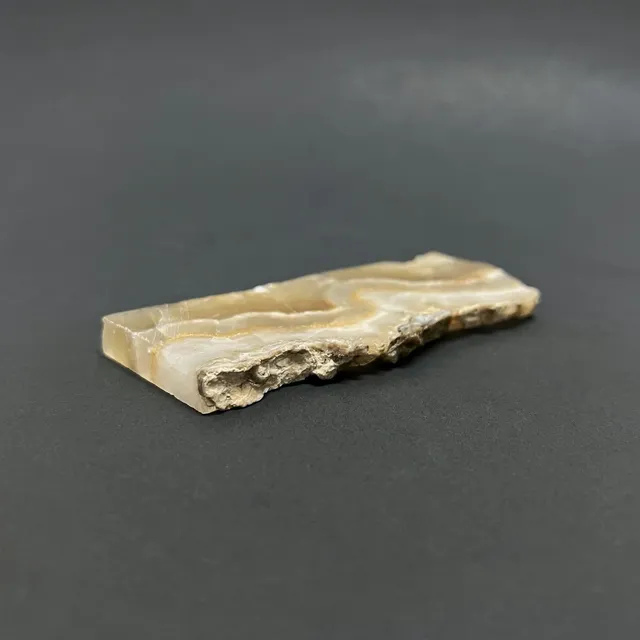 Hokkaidoite slice 2A08 in daylight (8/9) — 8.9 × 4.0 × 0.7 cm, Hokkaido, Japan · Kitsune Mineral