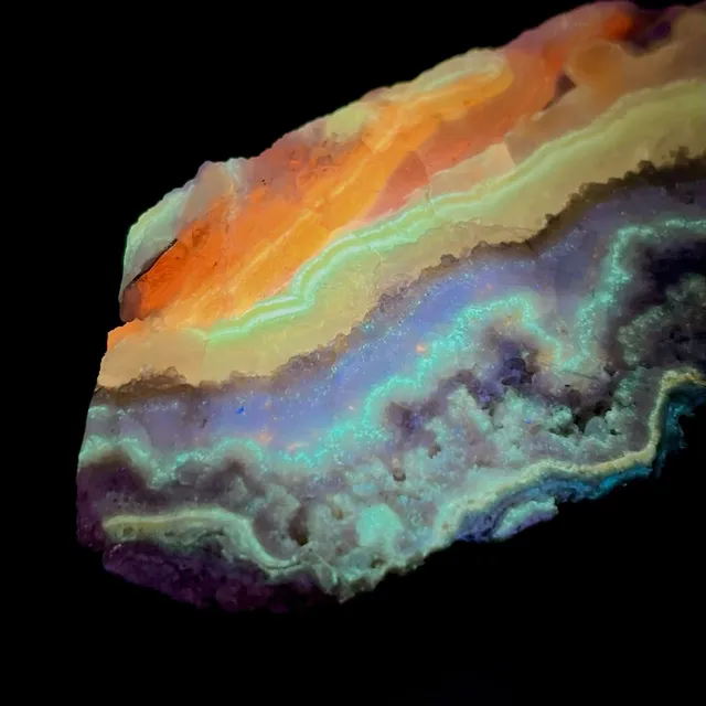 Hokkaidoite slice 2AL02 under UV light (3/10) — 11 × 6 × 1 cm, Hokkaido, Japan · Kitsune Mineral