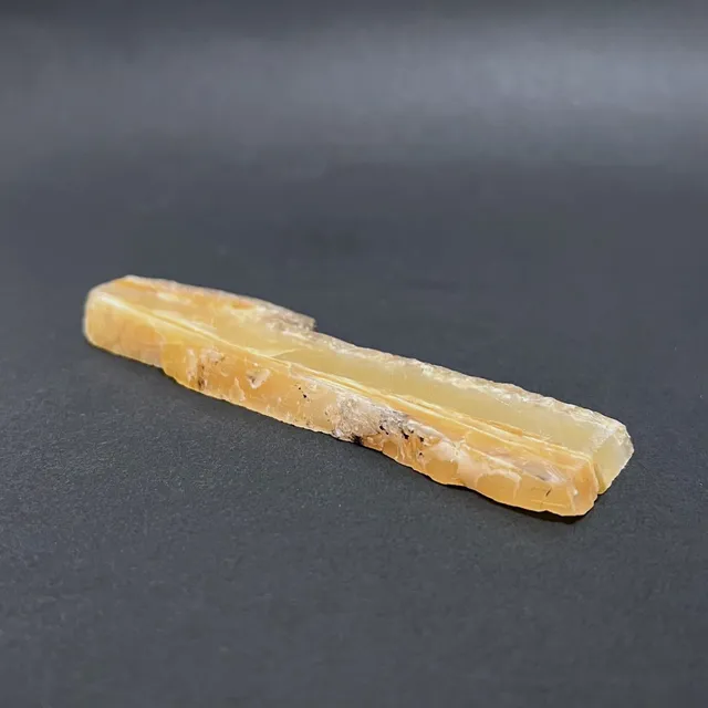 Hokkaidoite slice 2AL03 in daylight (9/10) — 11.4 × 3.1 × 0.9 cm, Hokkaido, Japan · Kitsune Mineral