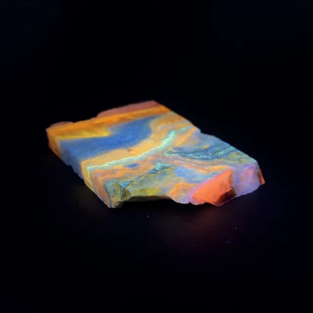 Hokkaidoite slice 2B01 under UV light (3/10) — 6.4 × 5.4 × 0.8 cm, Hokkaido, Japan · Kitsune Mineral