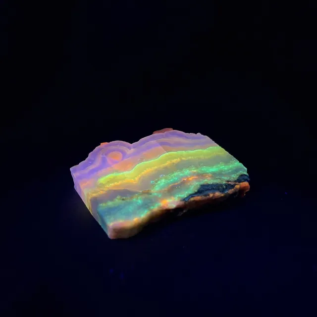 Hokkaidoite slice 2B03 under UV light (3/9) — 5.4 × 4.8 × 0.9 cm, Hokkaido, Japan · Kitsune Mineral