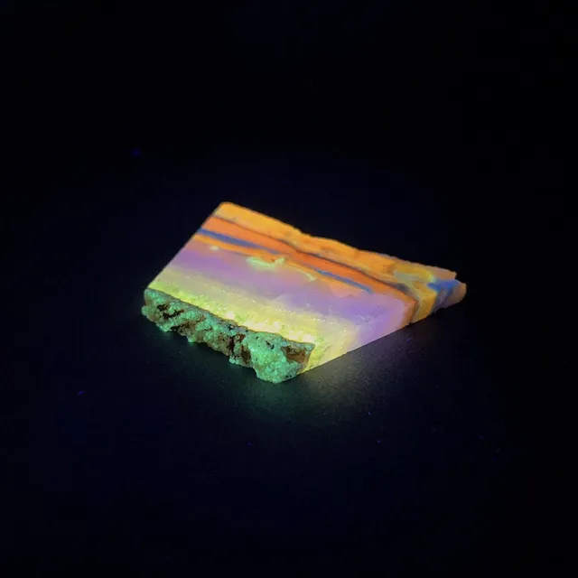 Hokkaidoite slice 2B04 under UV light (3/9) — 6.5 × 4.3 × 0.6 cm, Hokkaido, Japan · Kitsune Mineral