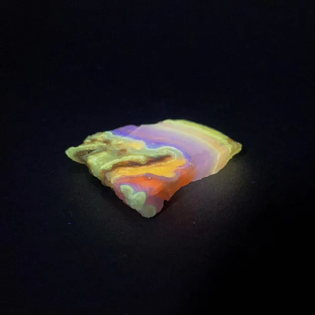 Hokkaidoite slice 2B05 under UV light (3/9) — 5.3 × 4.5 × 0.9 cm, Hokkaido, Japan · Kitsune Mineral