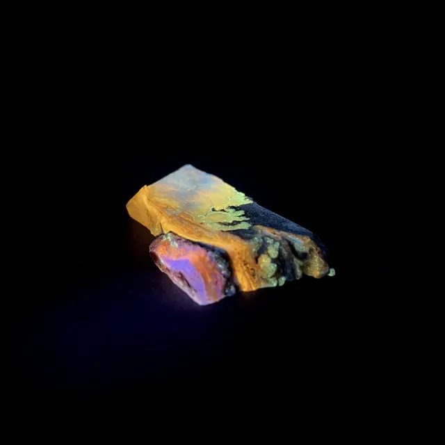 Hokkaidoite slice 2B09 under UV light (3/9) — 6.8 × 3.5 × 0.9 cm, Hokkaido, Japan · Kitsune Mineral