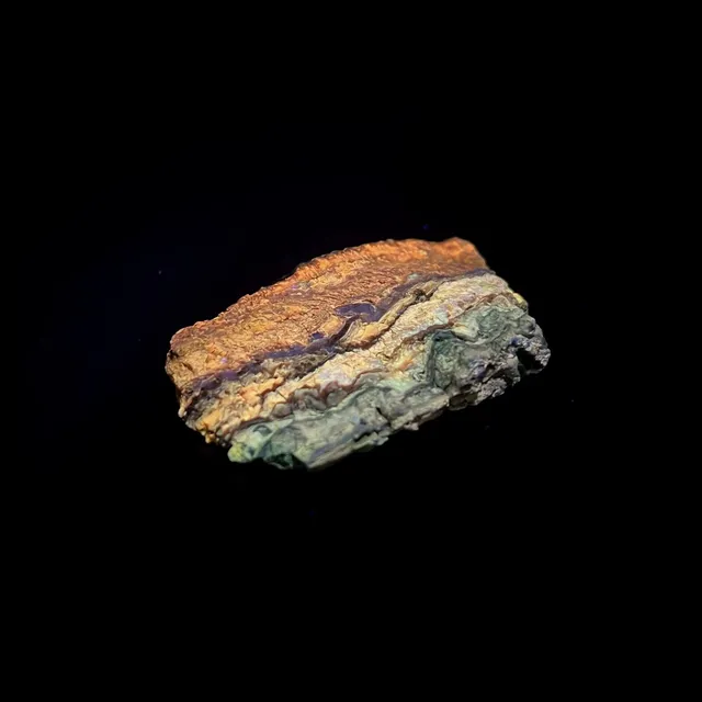 Hokkaidoite slice 2B11 under UV light (3/11) — 5.5 × 3.5 × 1.0 cm, Hokkaido, Japan · Kitsune Mineral