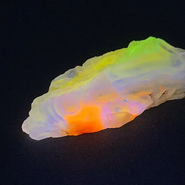 Hokkaidoite slice 2B12 under UV light (3/9) — 6.8 × 2.8 × 0.6 cm, Hokkaido, Japan · Kitsune Mineral