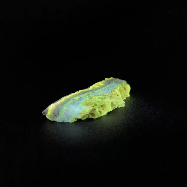 Hokkaidoite slice 2B13 under UV light (3/9) — 6.5 × 2.5 × 0.9 cm, Hokkaido, Japan · Kitsune Mineral
