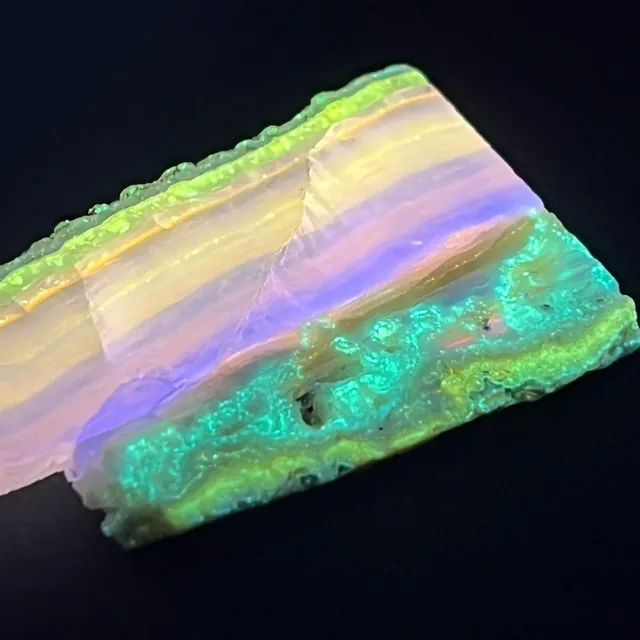 Hokkaidoite slice 2B15 under UV light (3/9) — 3.6 × 5.2 × 0.5 cm, Hokkaido, Japan · Kitsune Mineral