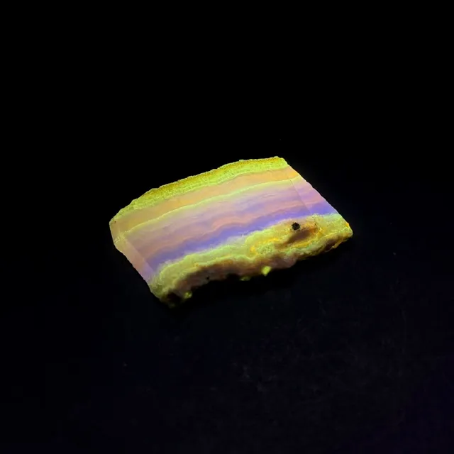 Hokkaidoite slice 2C01 under UV light (3/9) — 5.4 × 4.1 × 0.5 cm, Hokkaido, Japan · Kitsune Mineral