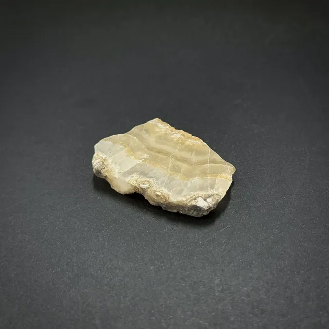 Hokkaidoite slice 2C04 in daylight (8/9) — 4.6 × 3.0 × 0.6 cm, Hokkaido, Japan · Kitsune Mineral