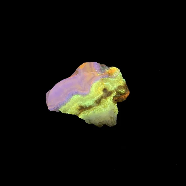 Hokkaidoite slice 2C07 under UV light (3/9) — 3.8 × 3.2 × 0.7 cm, Hokkaido, Japan · Kitsune Mineral