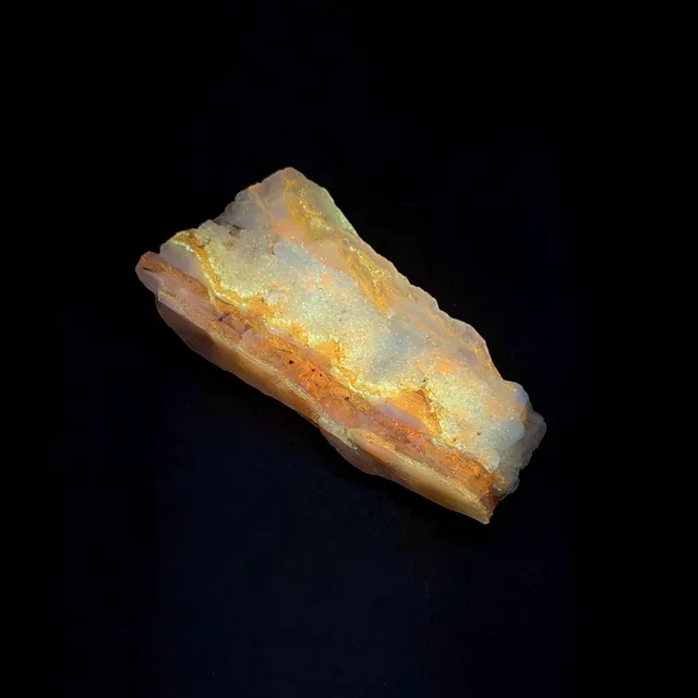 Hokkaidoite slice 2C08 under UV light (3/9) — 5.3 × 2.4 × 1.2 cm, Hokkaido, Japan · Kitsune Mineral