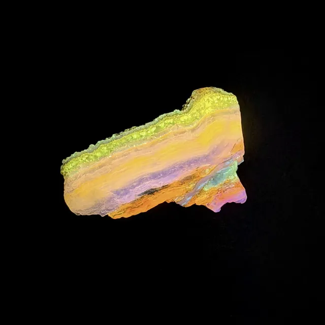 Hokkaidoite slice 2C09 under UV light (3/9) — 4.7 × 2.8 × 0.7 cm, Hokkaido, Japan · Kitsune Mineral