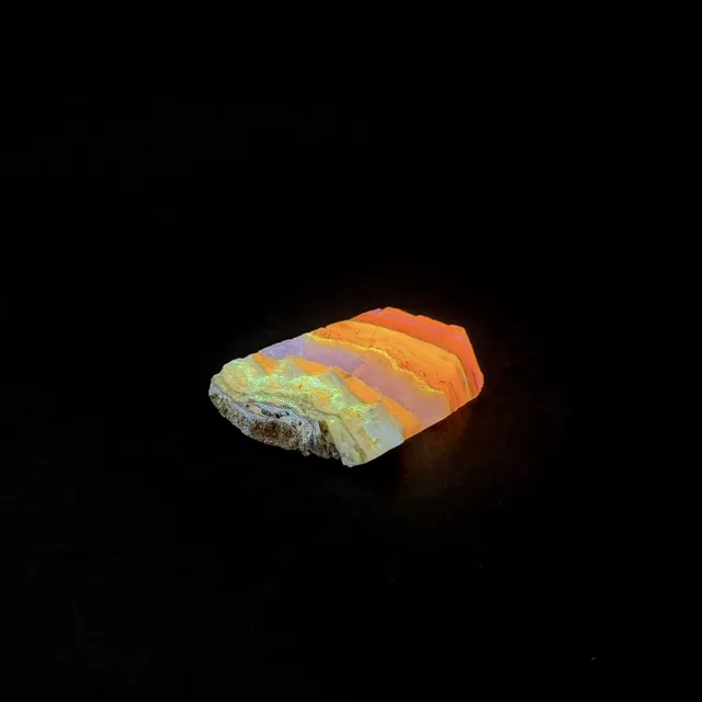 Hokkaidoite slice 2C16 under UV light (3/9) — 4.0 × 4.1 × 0.9 cm, Hokkaido, Japan · Kitsune Mineral
