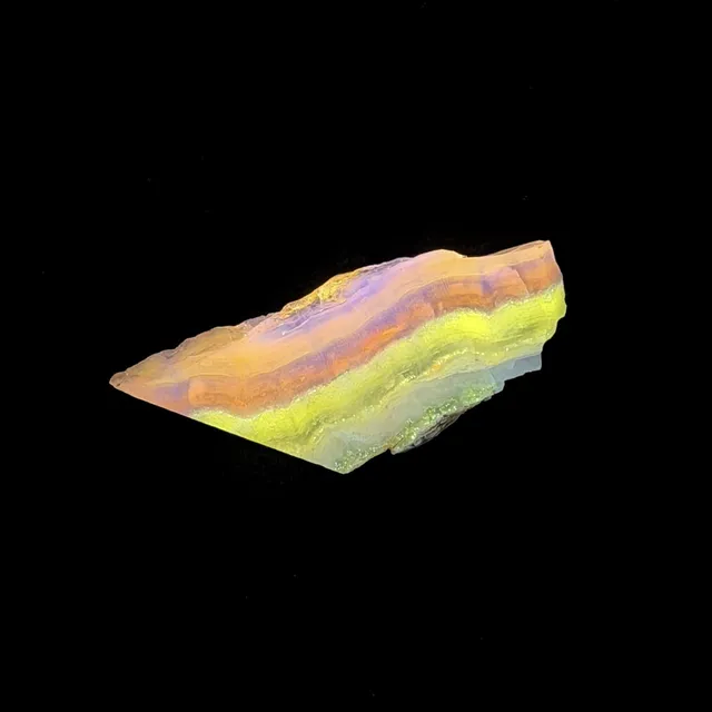 Hokkaidoite slice 2C17 under UV light (3/9) — 6.2 × 2.6 × 0.6 cm, Hokkaido, Japan · Kitsune Mineral