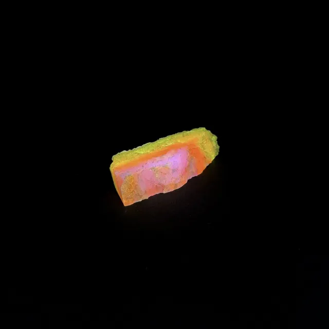 Hokkaidoite slice 2C18 under UV light (3/9) — 5.0 × 1.8 × 1.0 cm, Hokkaido, Japan · Kitsune Mineral