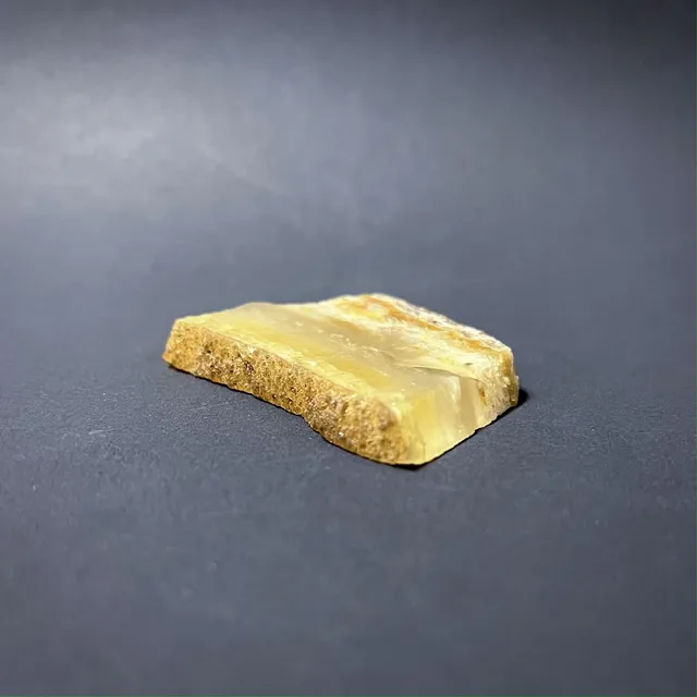 Hokkaidoite slice AL01 in daylight (7/8) — 5.7 × 4.2 × 0.7 cm, Hokkaido, Japan · Kitsune Mineral