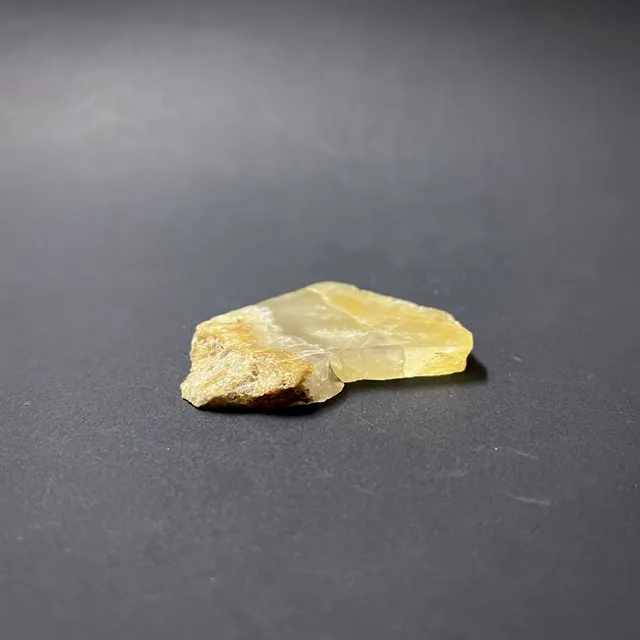 Hokkaidoite slice AM01 in daylight (7/9) — 5.0 × 4.1 × 0.7 cm, Hokkaido, Japan · Kitsune Mineral