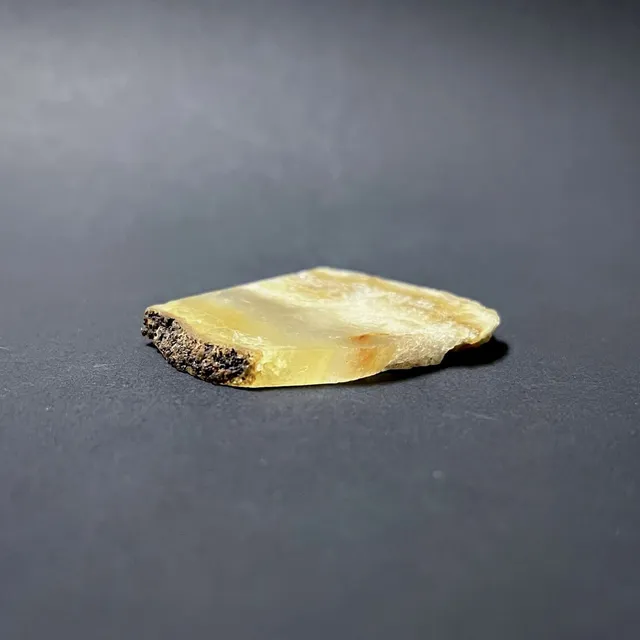 Hokkaidoite slice AM02 in daylight (7/8) — 4.8 × 4.0 × 0.5 cm, Hokkaido, Japan · Kitsune Mineral