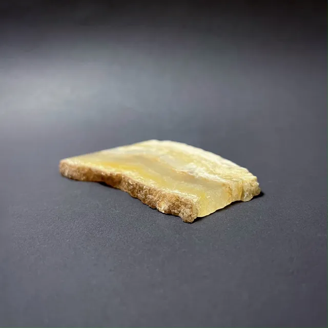 Hokkaidoite slice AXL01 in daylight (8/9) — 8.7 × 6.4 × 0.7 cm, Hokkaido, Japan · Kitsune Mineral