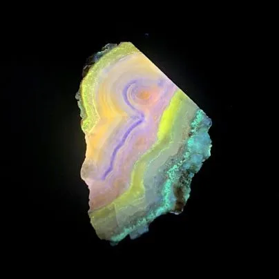 Hokkaidoite slice BL03 under UV light (3/9) — 6.8 × 5.6 × 0.7 cm, Hokkaido, Japan · Kitsune Mineral