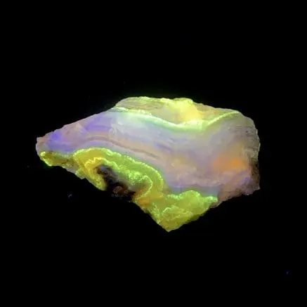 Hokkaidoite slice BM01 under UV light (3/9) — 5.6 × 3.4 × 0.6 cm, Hokkaido, Japan · Kitsune Mineral